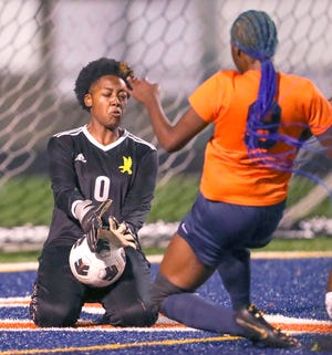 Firestone goalie Janiyah Powers stop a shot attempt by Ellet's Charisma Smith on Wednesday, Sept. 21, 2022 in Akron.