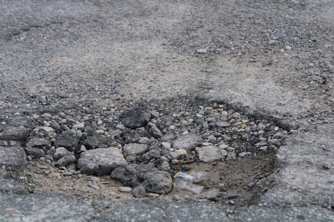 A pothole is shown on Ance Road near U.S. 31.  This road is one of several others to be fixed in the upcoming weeks by the city.