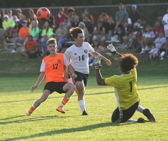 Gavyn Moore sends a ball toward the goal against Niles in prep soccer action. The ball sailed just wide of the net.