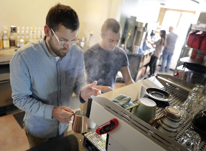 Ben Jones, left, and Tyler Haas working at Seth's Coffee in the former All Seasons Coffeehouse at 1390 Popp Lane in Grand Chute.