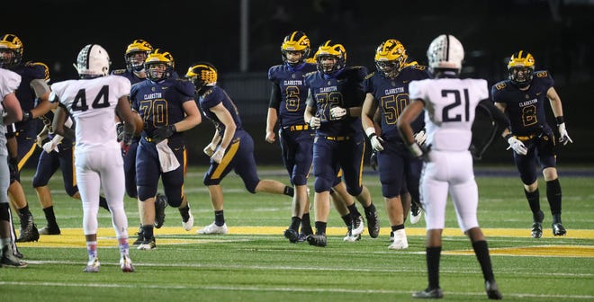 Clarkston, including offensive lineman Cole Dellinger (72), lines up for action against Grand Blanc on Friday, Nov. 6, 2020 at Clarkston High School.