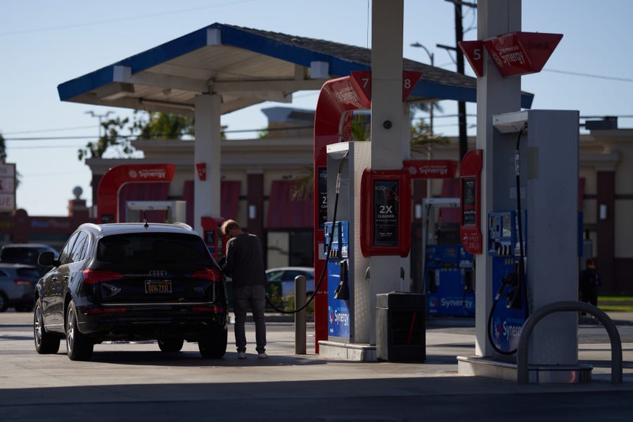 LOS ANGELES, CA - SEPTEMBER 21: A man pumps gas into his suv at an Exxon gas station on September 21, 2022 in Los Angeles, California. Gas prices have increased for the first time in almost 100 days.