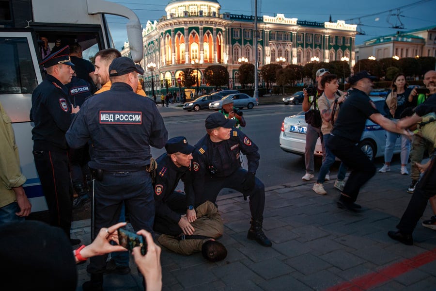 Police detain demonstrators during a protest against mobilization in Yekaterinburg, Russia, Wednesday, Sept. 21, 2022. Russian President Vladimir Putin has ordered a partial mobilization of reservists in Russia, effective immediately.