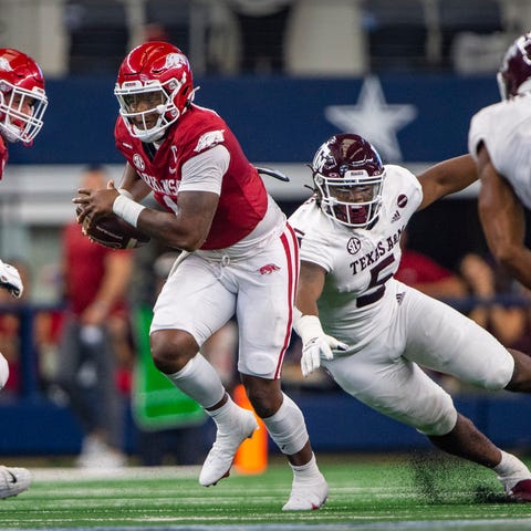 Arkansas quarterback KJ Jefferson carries the ball