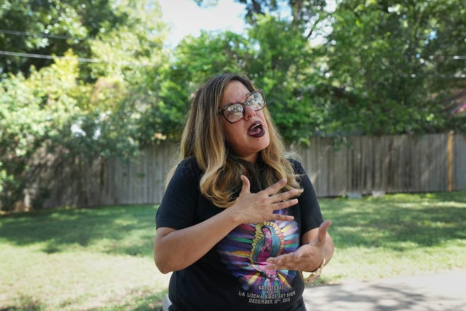 Bertha Rendon Delgado, longtime resident and community advocate, cries as she reminisces about her memories in the yard of the Quintanilla House. Growing up, Rendon Delgado frequented the house, which served as a hub for East Austin’s Chicano community.