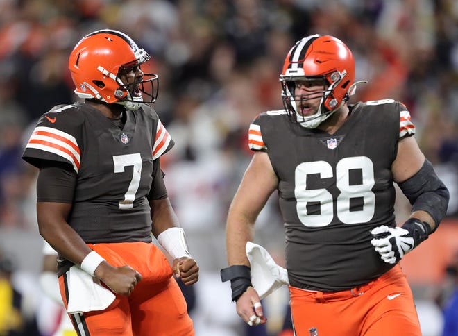 Cleveland Browns quarterback Jacobi Brissett (7) celebrates after his first lunge with Cleveland Browns guard Michael Dunn (68) during the second half of an NFL football game against the Pittsburgh Steelers, Thursday, Sept. 22, 2022, in Cleveland, Ohio.