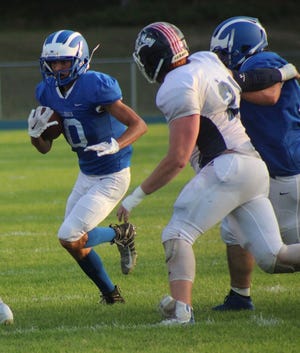 Inland Lakes senior football player Sam Mayer (left) has been voted on as the Daily Tribune's Week 4 Athlete of the Week.