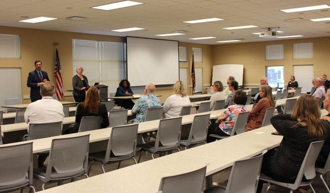 Community members, including local judges and attorneys, attend a candidates forum for the fifth judge seat in the Ottawa County Circuit Court on Monday, Sept. 19, 2022.