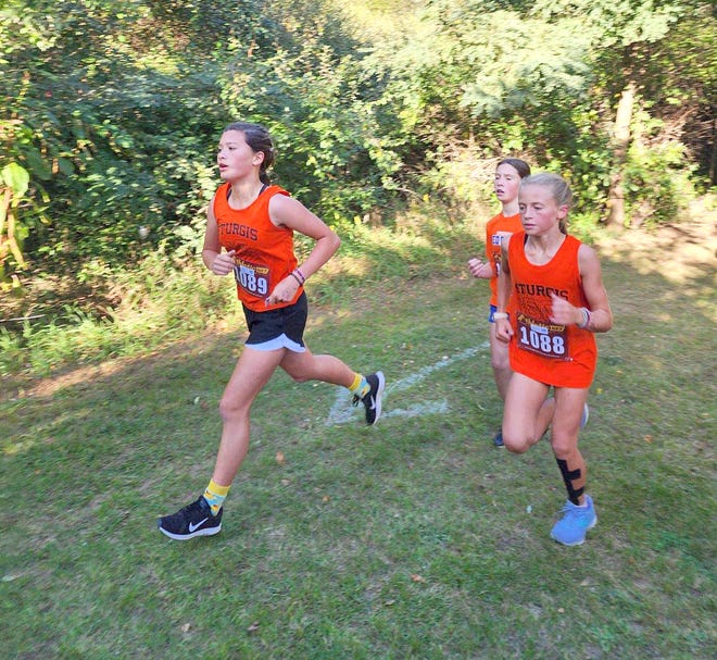 Eleanor Park and Madelyn Oswald run for Sturgis at Plainwell in cross country action on Thursday.