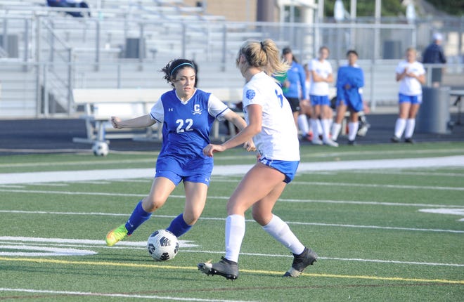 Chillicothe junior Ellie Cochenour (#22) moves downfield with the ball during a girls soccer match against Washington on Sept. 22, 2022. The Cavaliers won the match 11-0.