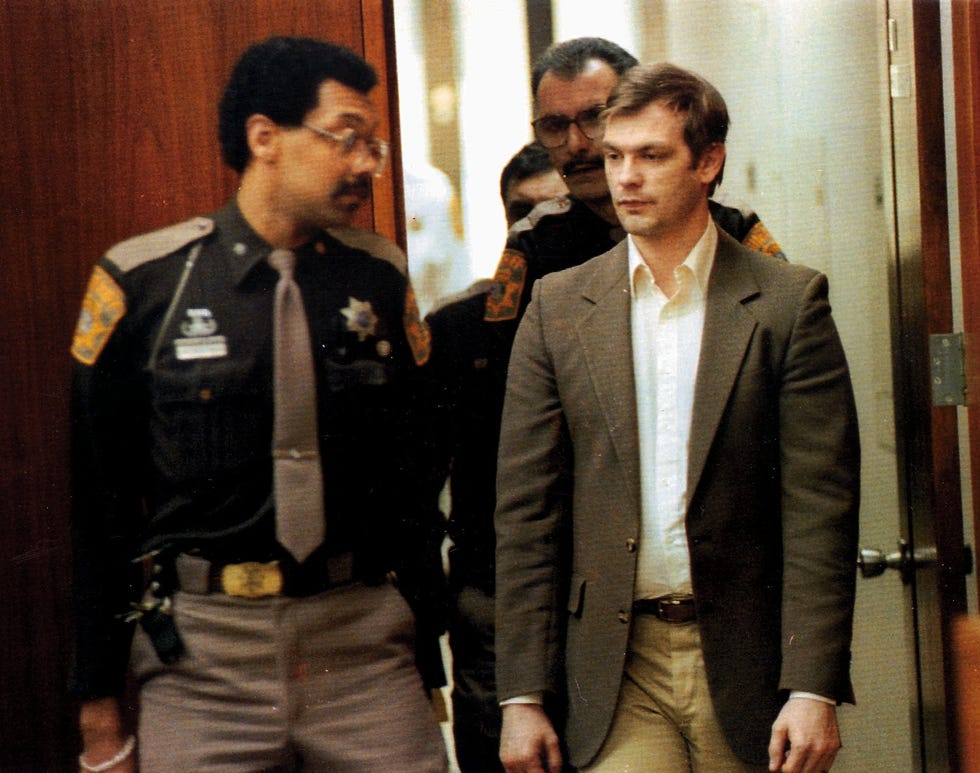 Serial killer Jeffrey Dahmer, right, is led into Milwaukee County Circuit Court in this Jan. 30, 1992, file photo.