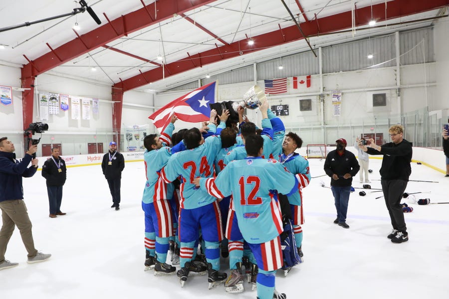 The Puerto Rico men's ice hockey team hoists the championship trophy after defeating Argentina 4-3 at the 2022 LATAM Cup on Sunday, September 18 in Coral Springs, Fla. Puerto Rico was hit by Hurricane Fiona during the game.