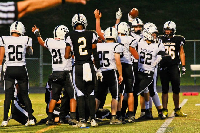South Side's AC Corfield celebrates a fumble recovery Friday night in Leetsdale against Quaker Valley.