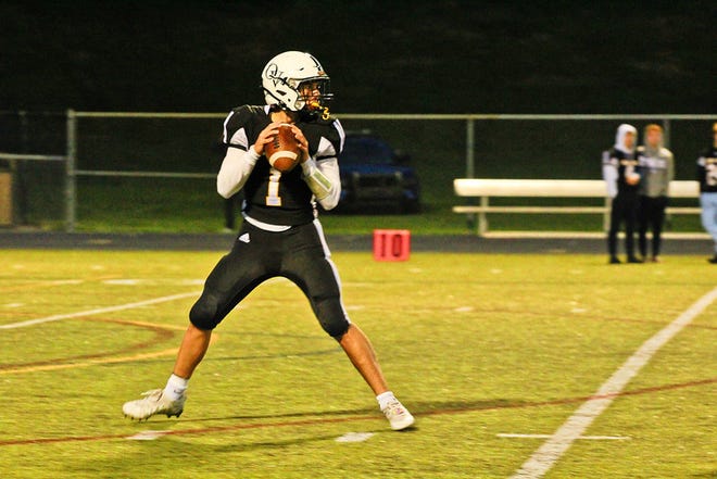 Quaker Valley quarterback Troy Kozar drops back to throw Friday night against South Side in Leetsdale.