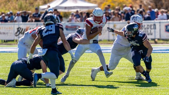 CSU Pueblo quarterback Steve Croell tries to escape the defensive pressure of the Colorado School of Mines on Saturday.