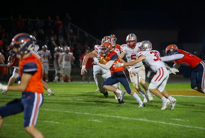 Galion's Gabe Ivy slips past the first line of defense into open field evading a tackle from Shelby's Dennis Lafon.