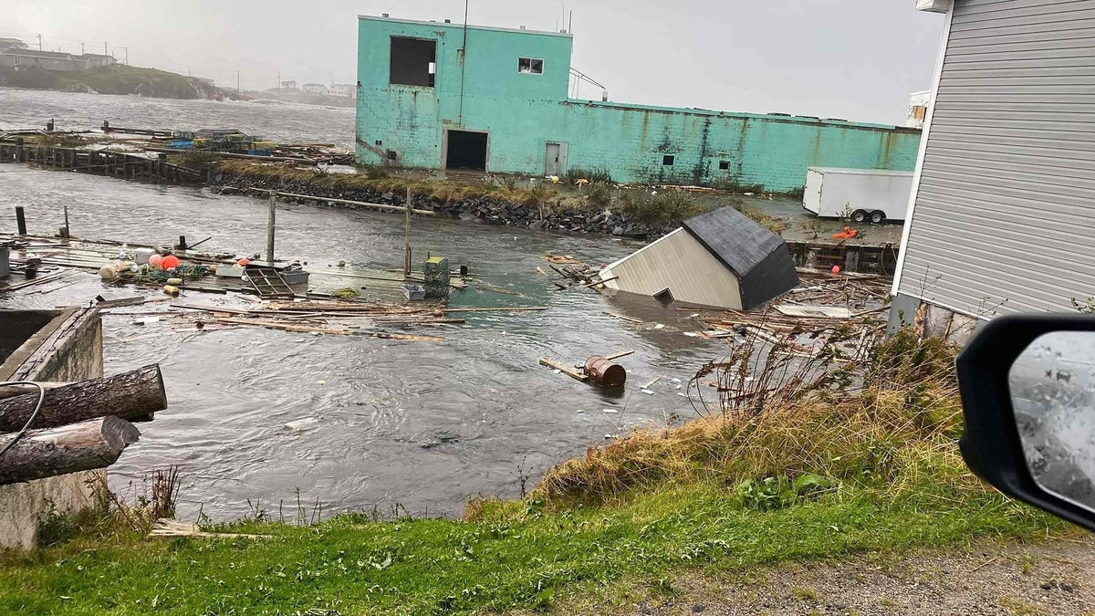 This September 24, 2022, image courtesy of Michael King, special advisor to Newfoundland and Labrador Premier Andrew Furey, and his family, shows damaged caused by post-tropical storm Fiona on the Burnt Islands, in the Newfoundland and Labrador Province of Canada. - Fiona knocked out power to more than 500,000 households as it lashed eastern Canada with strong winds and heavy rain on Saturday, electricity providers said.  In the province of Novia Scotia alone, at least   400,000 households lost electricity after Fiona, downgraded from a hurricane to a post-tropical storm but still packing winds of 85 miles per hour, made landfall, Novia Scotia Power reported.
