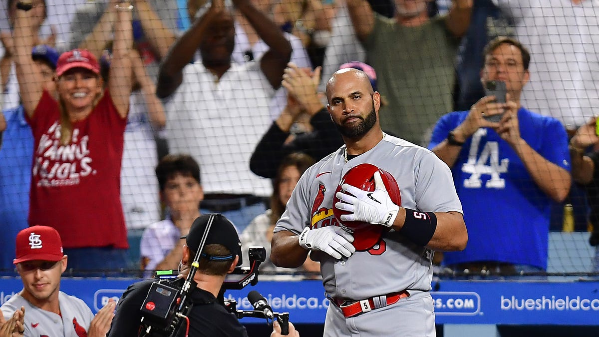 St. Louis Cardinals designated hitter Albert Pujols acknowledges the crowd after hitting his 700th career home run at Dodger Stadium.