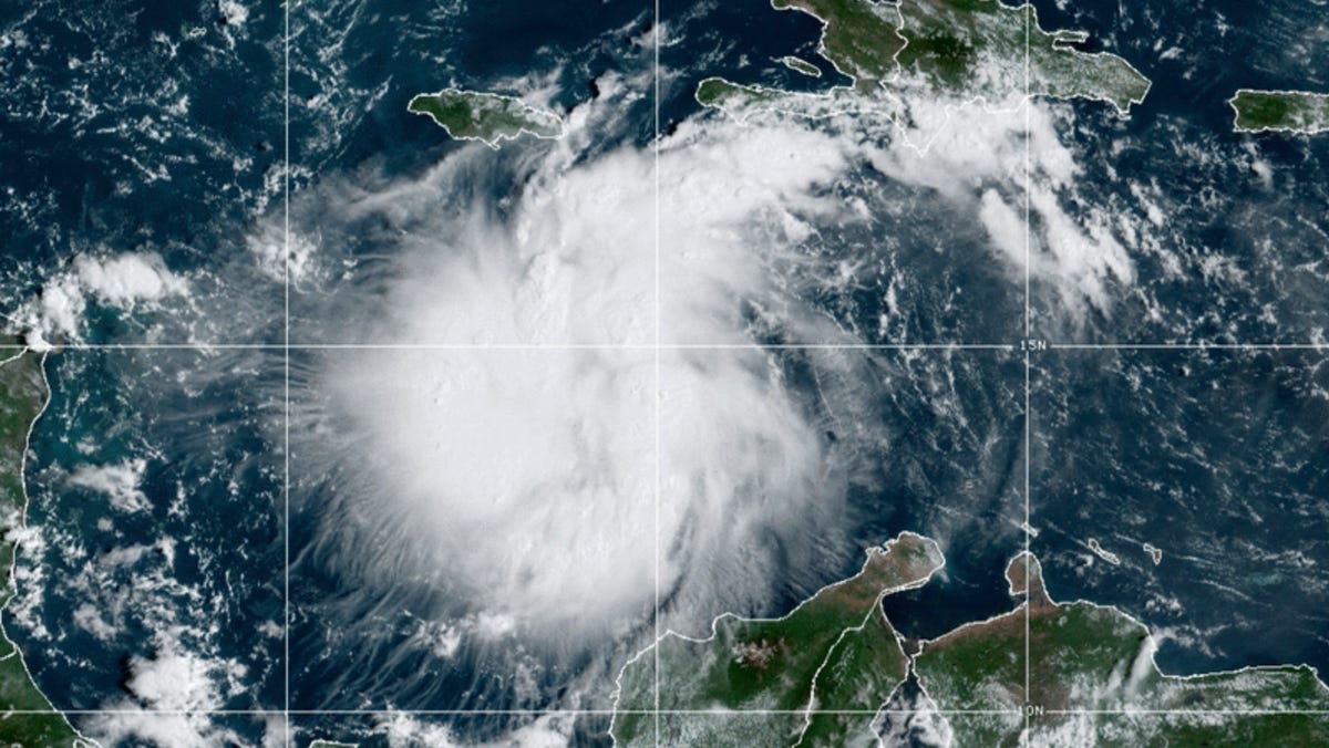 This satellite image provided by the National Oceanic and Atmospheric Administration shows Tropical Storm Ian over the central Caribbean on Saturday, Sept. 24, 2022.