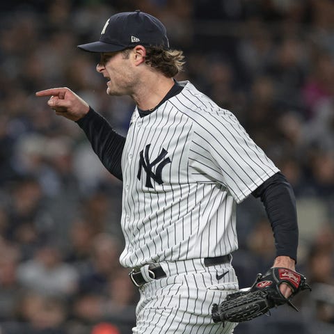 Gerrit Cole screams at the home plate umpire in th