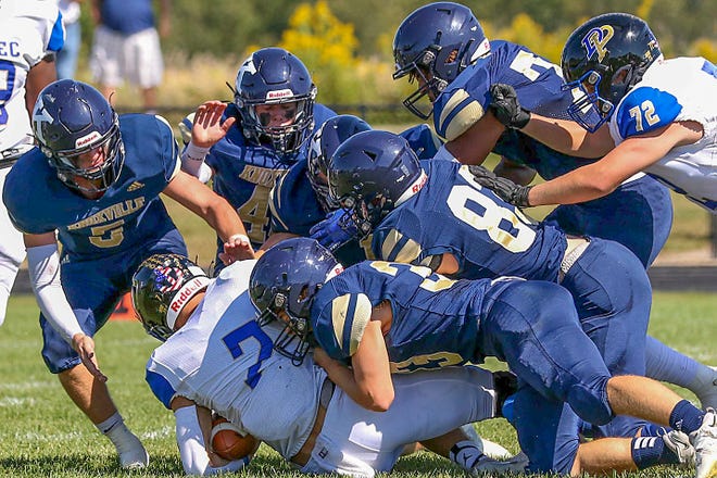 The Knoxville defense piles onto a DuPec ball carrier during the Blue Bullets' 16-7 home loss to the Rivermen on Saturday, Sept. 24, 2022 at Dennis Larson Field.