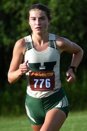 Howell's Mackenzie Wright became the first Livingston County girl to break 19 minutes this fall in the Jackson Invitational.