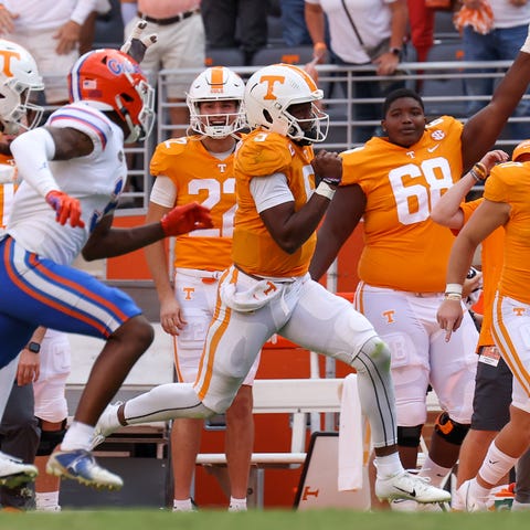 Tennessee quarterback Hendon Hooker runs with the 