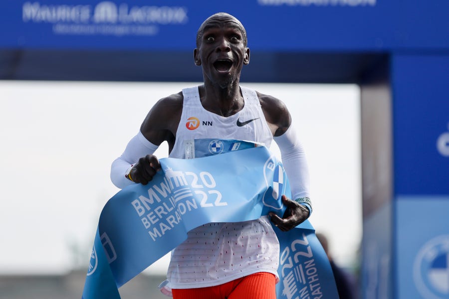 September 25, 2022 : Kenya's Eliud Kipchoge crosses the line to win the Berlin Marathon in Berlin, Germany. Olympic champion Eliud Kipchoge has bettered his own world record in the Berlin Marathon. Kipchoge clocked 2:01:09 on Sunday to shave 30 seconds off his previous best-mark of 2:01:39 from the same course in 2018. 