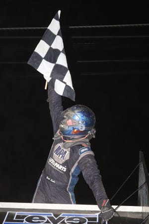 Zeth Sabo celebrates in Victory Lane after his first career win at Fremont Speedway.