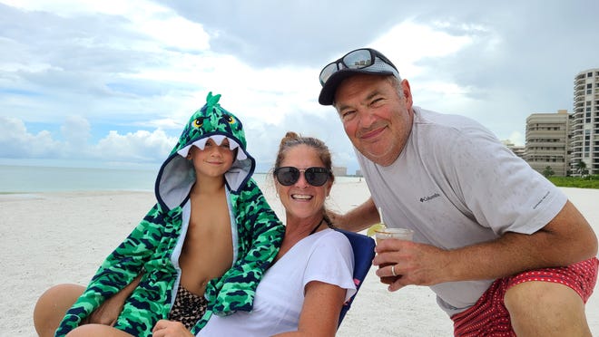 Overcast skies on Sept. 26 were not enough to stop Melissa and Edward McHugh and their grandson Eli from having fun on Marco Island's South Beach.
