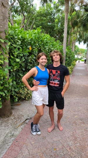 Kaitlyn Abellar and Kai Spitzer along South Beach's walkway on Marco Island.