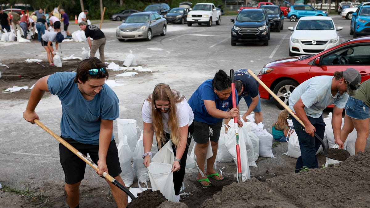Florida residents fill sandbags at Helen Howarth Park as they prepare for the possible arrival of Hurricane Ian on September 26, 2022 in St Petersburg, Florida.