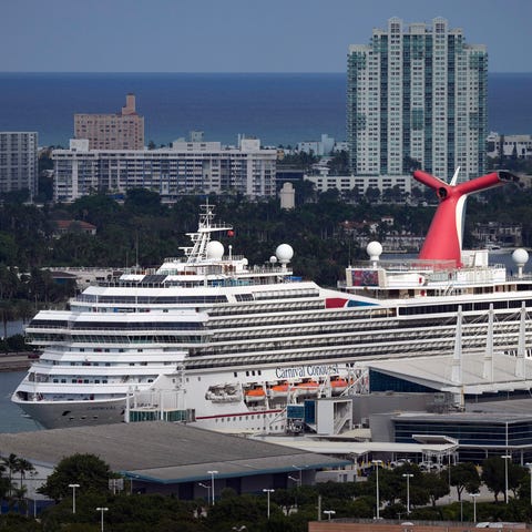 The Carnival Conquest cruise ship sits docked at p