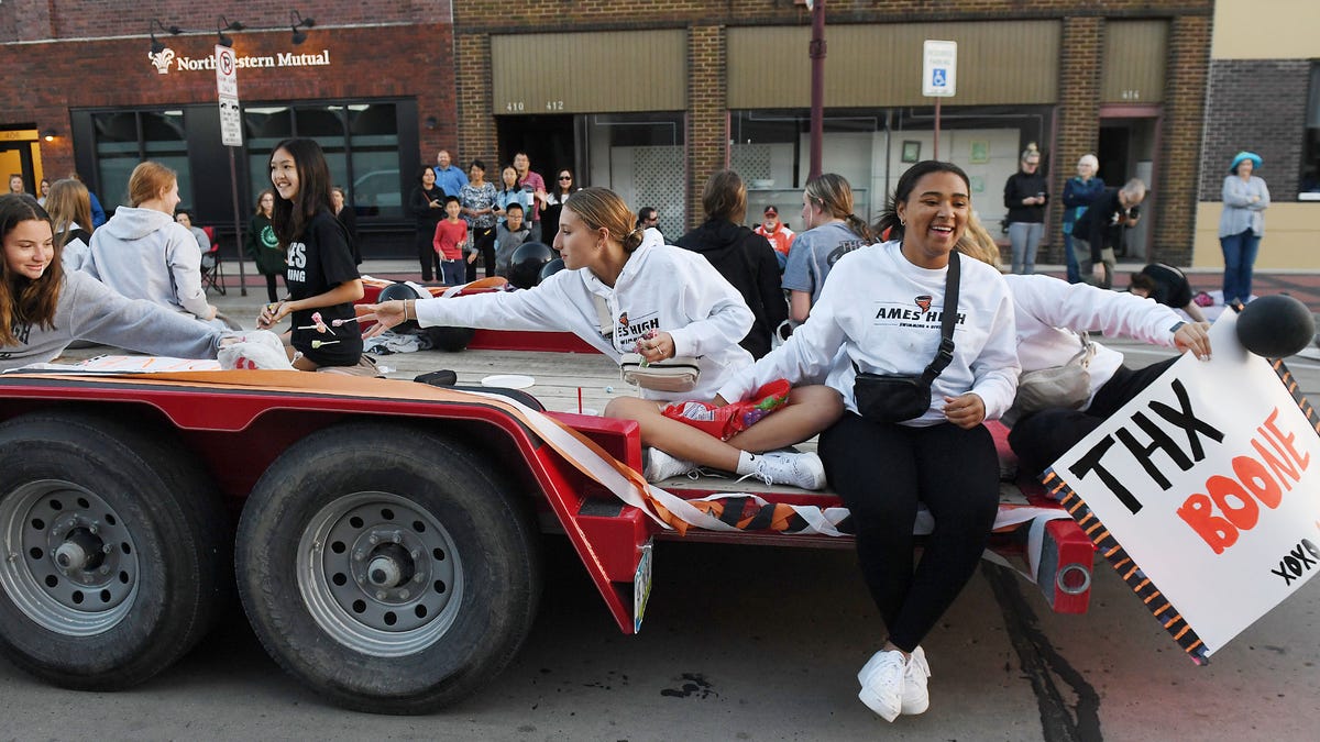 Ames High School parade passes through downtown Ames