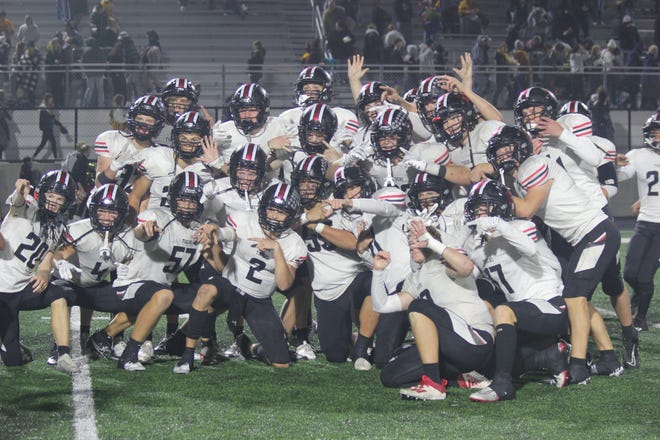 ADM players celebrate after taking down Atlantic 56-27 on Friday, Sept. 23, 2022, during the Trojans' homecoming.