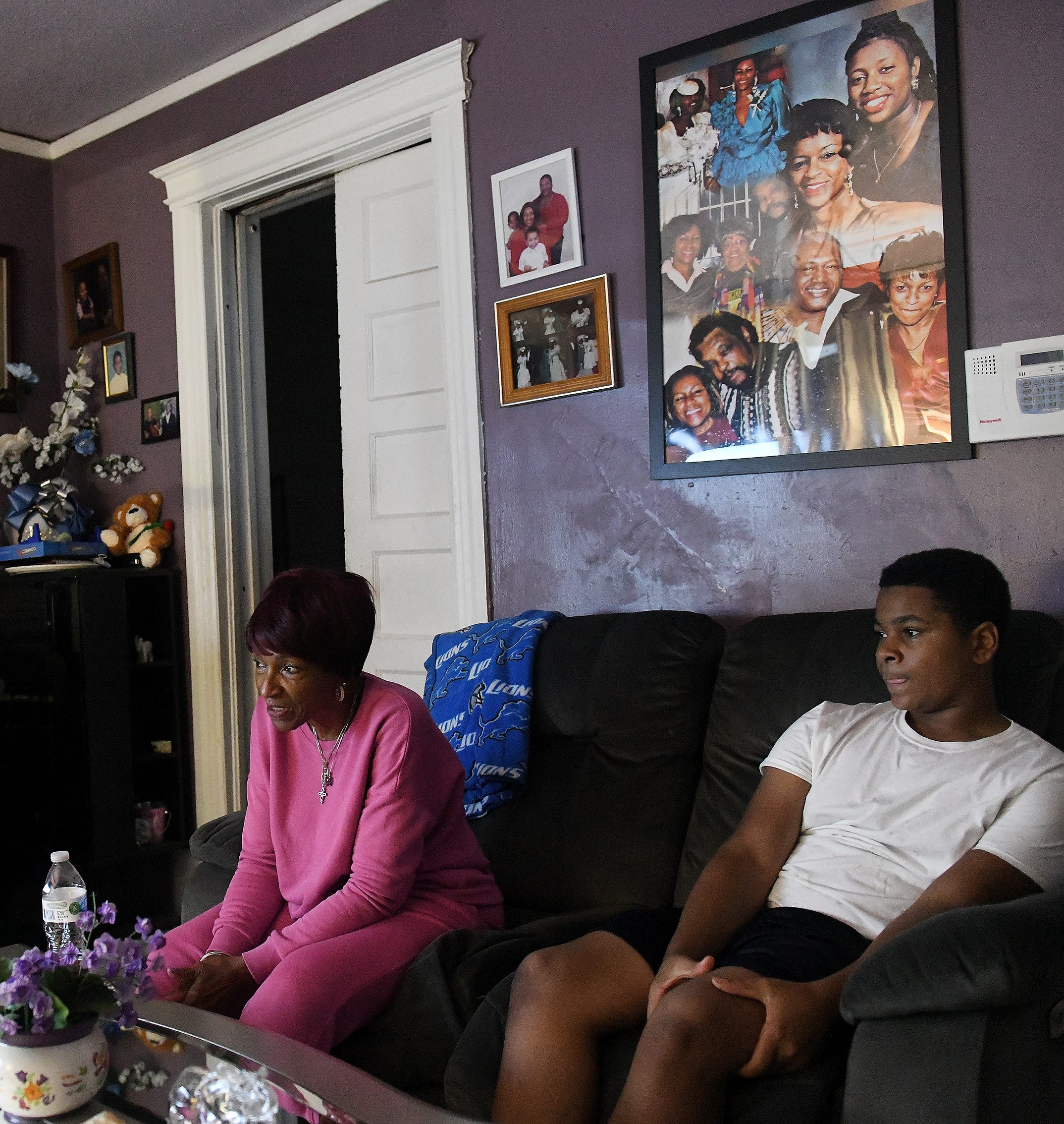 Navelle Jenkins, 78, of Detroit with her grandson, Shane, 15, at their home in Detroit. Jenkins is raising Shane after the death of his mother, Jenkins' daughter.