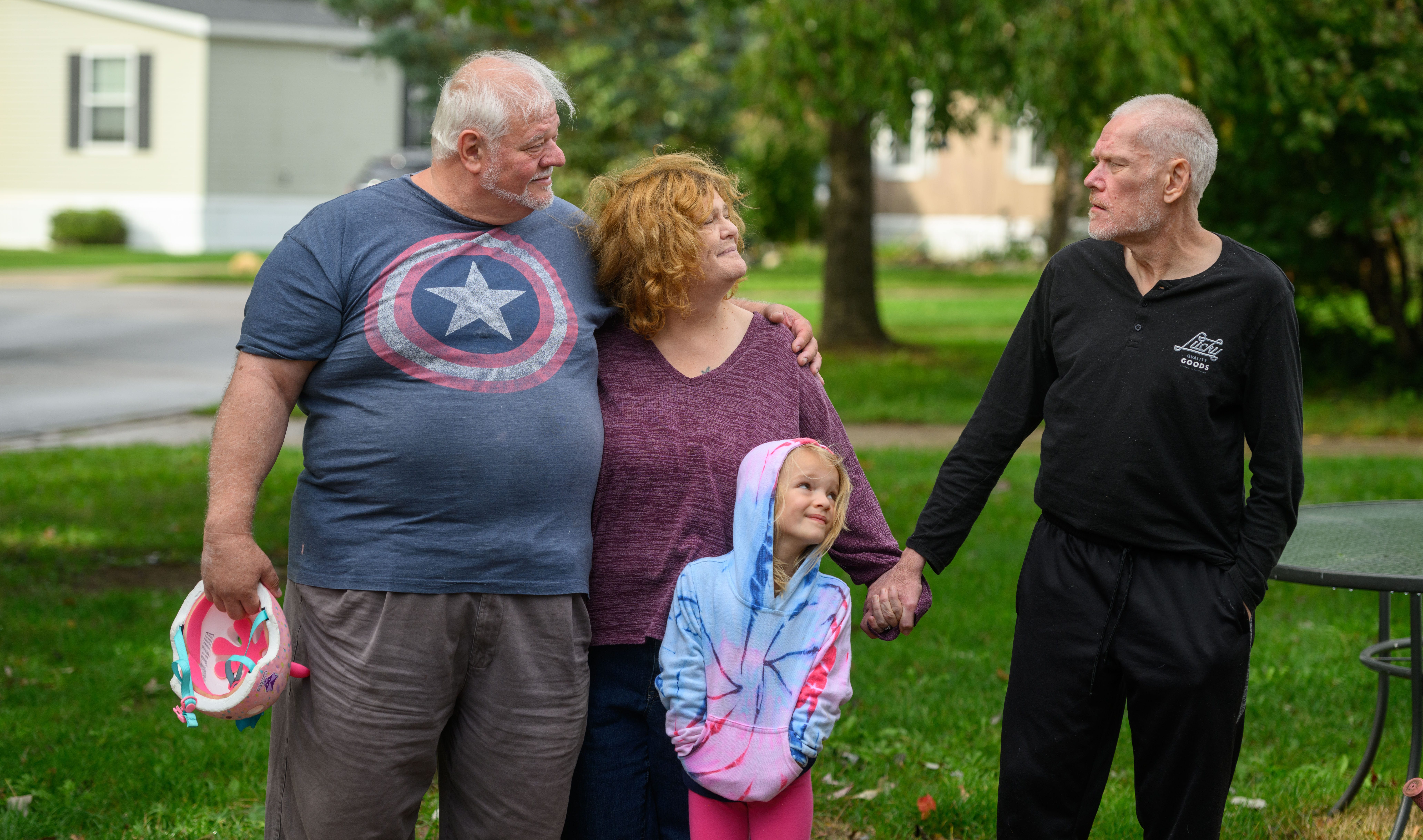 Ken Firth, from left, his wife, Sue, their six-year-old granddaughter. Aurora Hendry, and Ken’s brother-in-law, Grant Abrams, at their home in White Lake Township. Ken and Sue are caretakers for Grant, who is autistic, as well as their granddaughter.