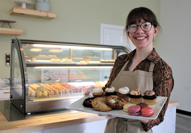 McKayla Dietzen, owner of McKayla Marie Sweets, shows some of the desserts offered in her bakery.
