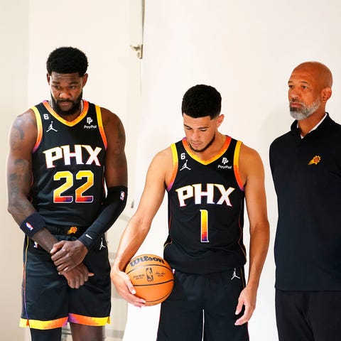 Phoenix Suns Deandre Ayton, Devin Booker, and head