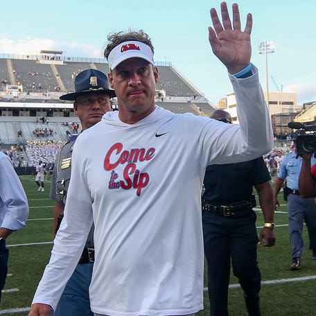 Mississippi coach Lane Kiffin waves to fans after his team's defeat of Georgia Tech at Bobby Dodd Stadium in 2022.
