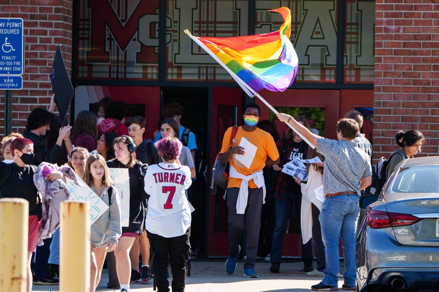 McLean High School students walk out in protest of Gov. Glenn Youngkin's policy that would restrict the rights of transgender students. Nearly 100 schools across the state held walkouts throughout the day on Tuesday, Sept. 27, 2022.
