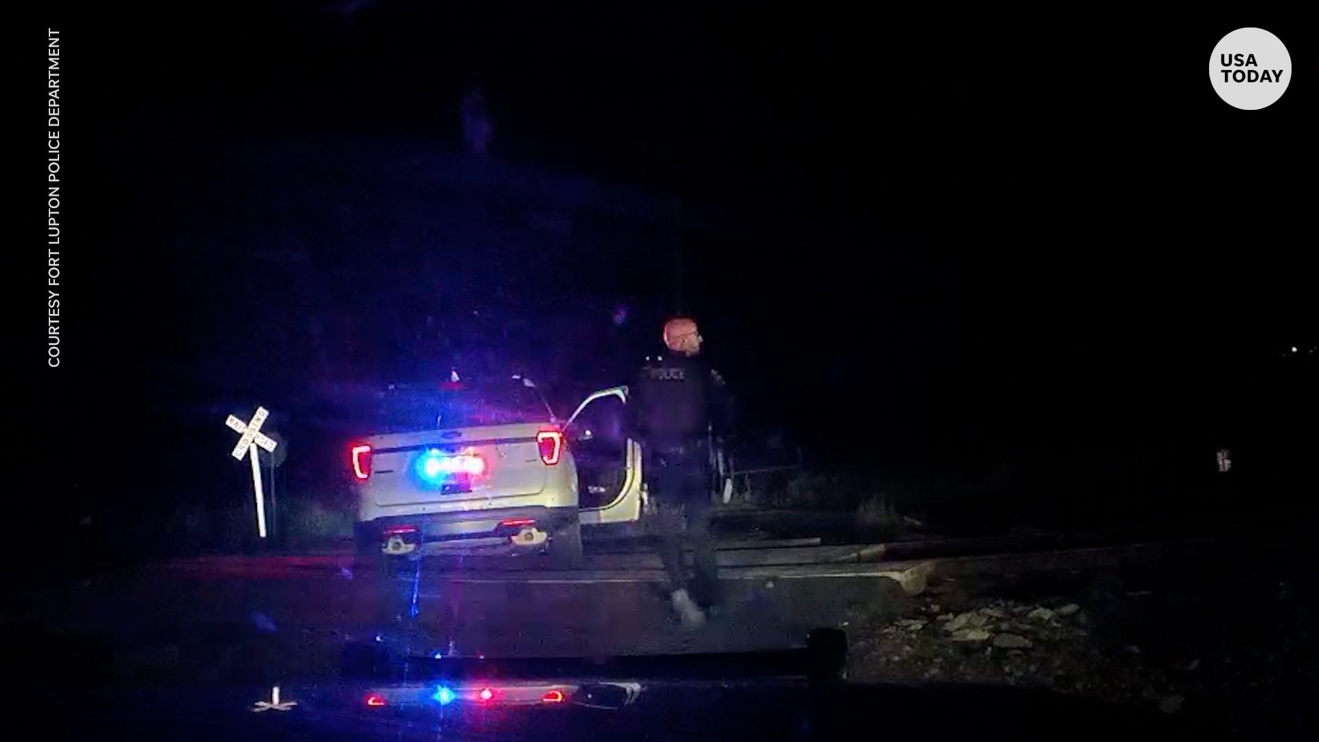 Train smashes into Colorado police cruiser with detained woman in the back seat