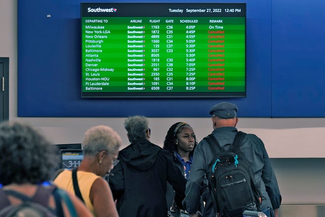 A sign that shows canceled flights at the Tampa International Airport on Sept. 27, 2022, in Tampa, Fla.