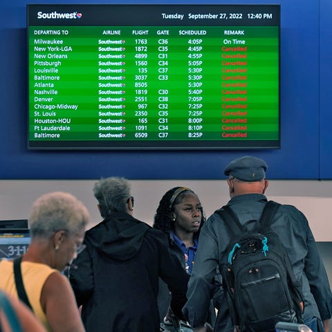 Southwest Airline passengers check into a ticket c