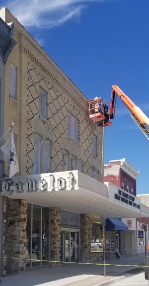 Waterproofing the building and replacing the windows on the historic theater is one of the first phases of the Camelot's restoration.