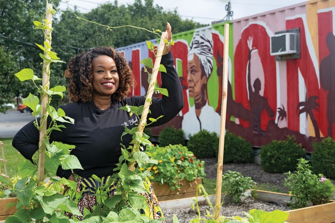 Shayla Favor on the Near East Side at the Maroon Arts Group Box Park on Mount Vernon Avenue, which features gardens and local artwork