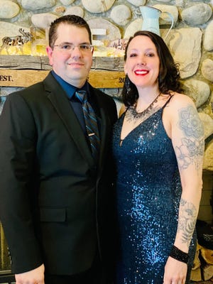 Cassandra Schmidt and her husband, Chris, pose for a photo at the first responder's gala earlier this year.