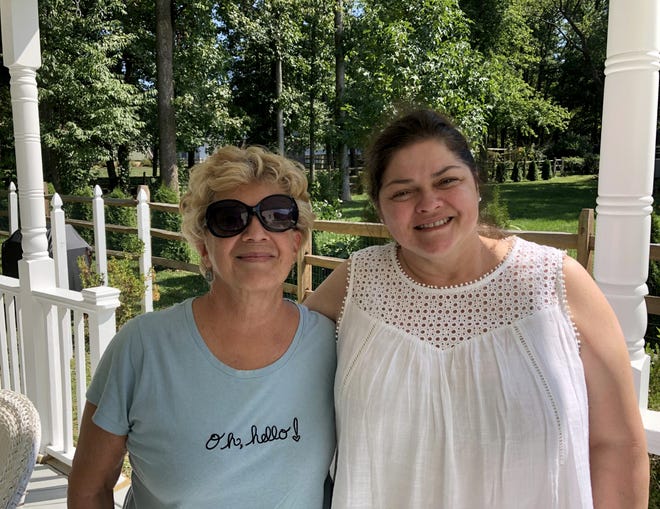 Carolyn Doerr (left) and her daughter-in-law Rose pose together on Rose's back porch in Newark, Delaware, on Sept. 19, 2022.