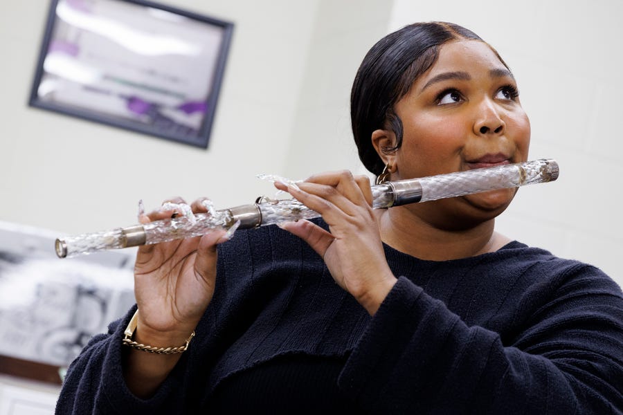 Lizzo practices the flute Monday, Sept. 28, 2022 at the Library of Congress in Washington, D.C.