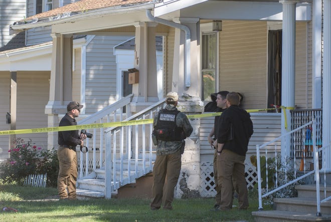 Police investigate the scene of a double homicide Thursday, Sept. 29, 2022 in the 100 block of North Cedar Street in West Peoria.